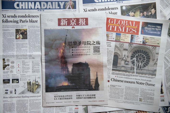 Front pages of the China Daily (left), the Beijing News (center), and the Global Times (right) featuring reaction to the Notre Dame Cathedral fire, which took place on April 15, 2019.