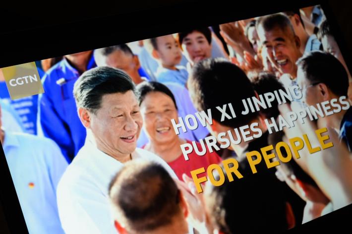The title screen of a program called “How Xi Jinping Pursues Happiness For People” from the CGTN archive is seen as it plays on a computer monitor in London.
