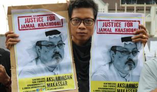 Humanitarian activists hold a poster with a picture of Jamal Khashoggi, a journalist who was killed in Turkey. Makassar, Indonesia. 18 October 2018. Editorial credit: Herwin Bahar / Shutterstock.com   