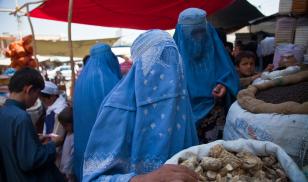 Burqa clad women at market