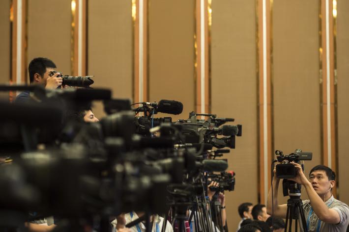 Chengdu, China — Chinese journalists stand by their video cameras during the G20 High-level Tax Symposium, part of the G20 finance ministers meeting in Chengdu, in China's Sichuan province on July 23, 2016. Photo by Fred Dufour/AFP via Getty Images.