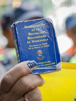 Detail of a copy of the Constitution of Venezuela. In the hands of a demonstrator against the government of Nicolás Maduro.  Venezuela.  Decmeber 2016. Editorial credit:  StringerAL / Shutterstock.com 