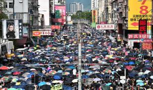 Protesters demonstrate in the district of Yuen Long in Hong Kong on July 27, 2019. Photo Credit: ANTHONY WALLACE/AFP via Getty Images.