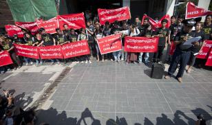 Reporters hold banners as they attend a demonstration march for press freedom. Yangon, Myanmar. 7 January 2014.  Editorial credit: Ye Aung Thu/AFP via Getty Images 