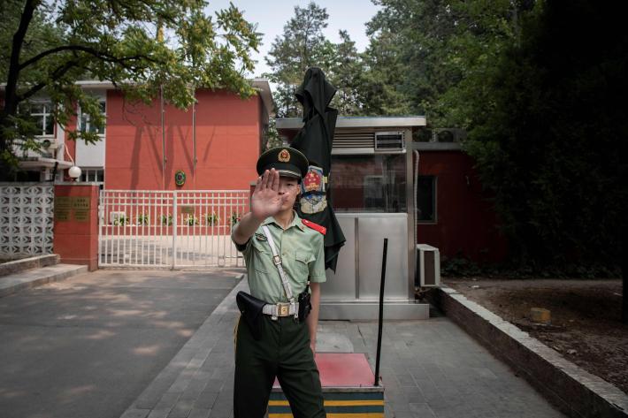 Beijing -- A police officer outside the Belgium embassy in Beijing on June 19, 2019. Nicolas Asfouri/AFP via Getty Images.