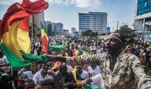Ethiopians wave national flags and celebrate in the streets of Addis Ababa the return of Berhanu Nega, the leader of the former armed movement Ginbot 7, after 11 years in exile, on September 9, 2018. Credit: YONAS TADESSE/AFP/Getty Images.